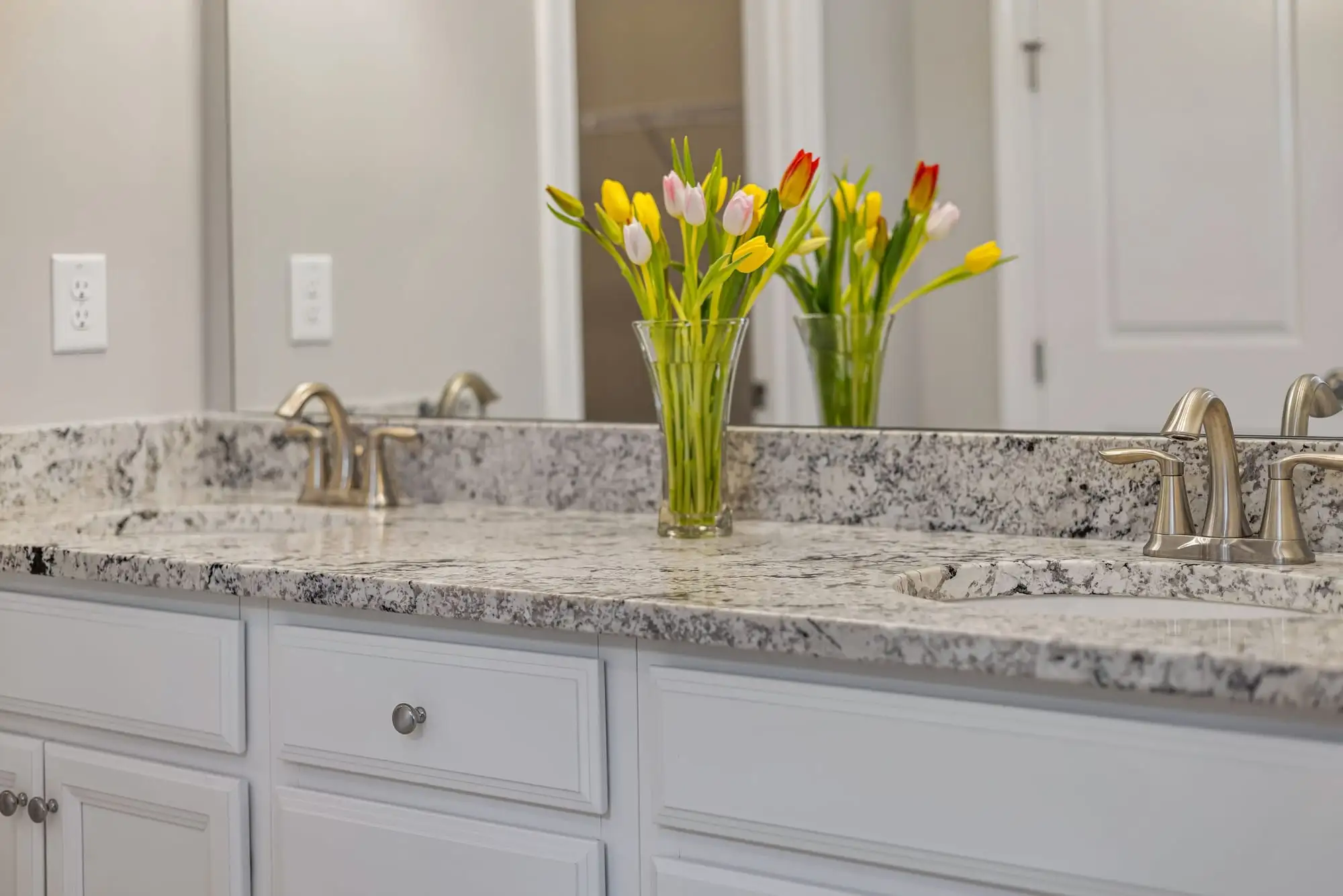 Bathroom vanity with a granite countertop