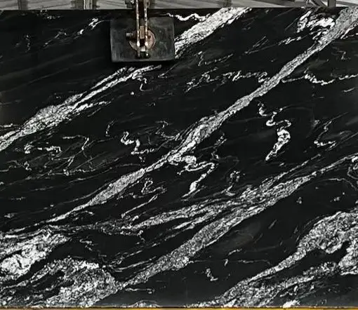 Polished black granite slab with white veining