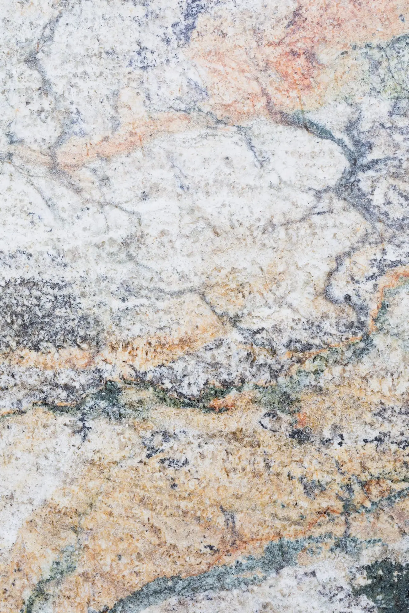 Multicolour granite slab with cream, grey and rust tones