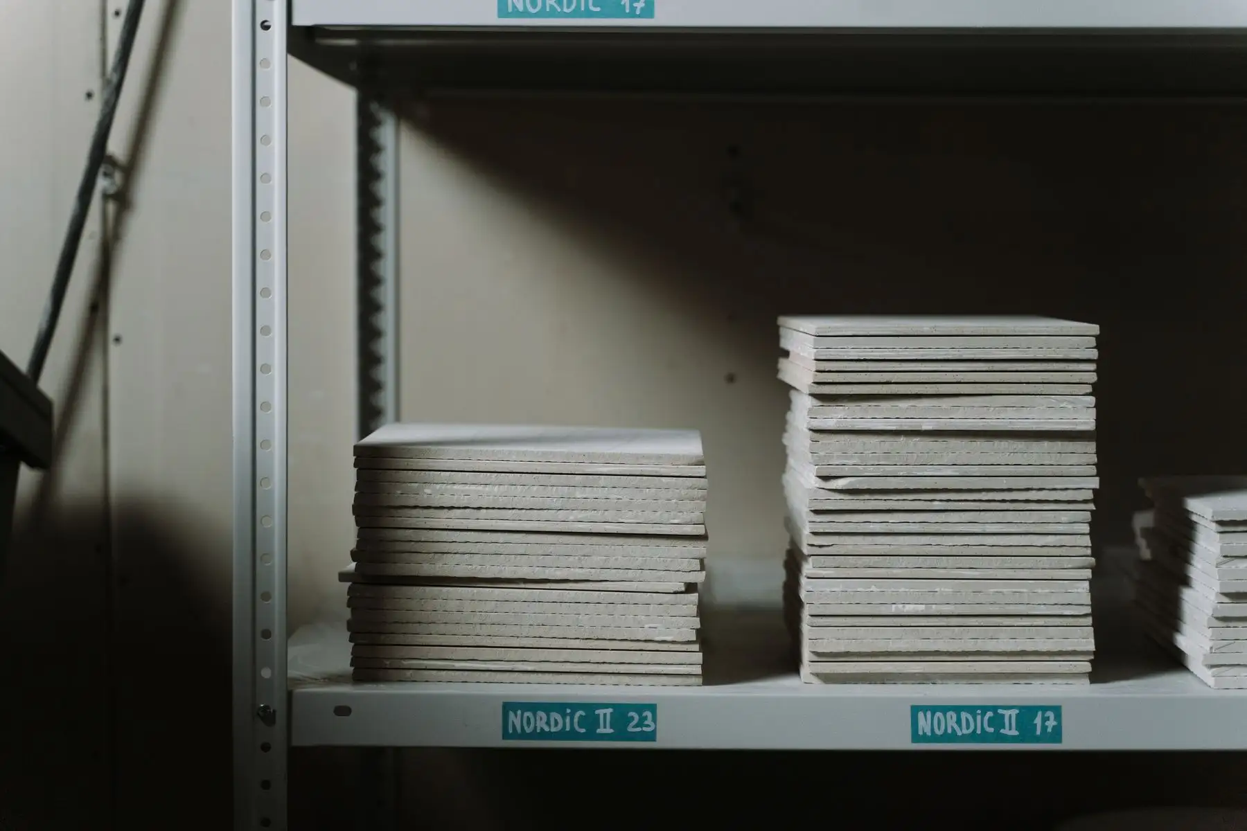 Stacks of ceramic tiles on warehouse shelves