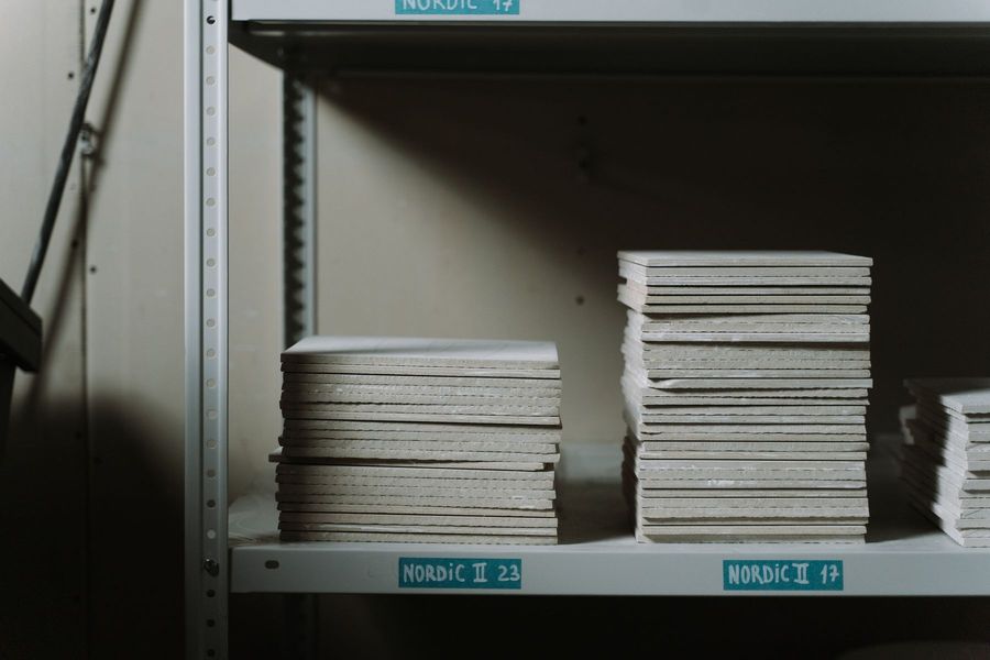 Stacks of ceramic tiles on warehouse shelves